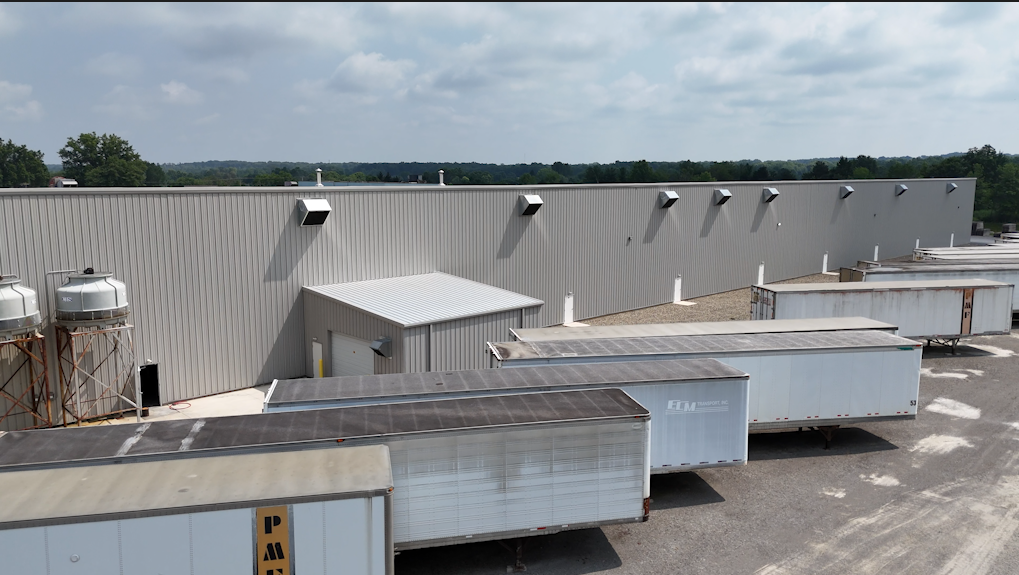 Trucking and delivery cargo freights parked behind building