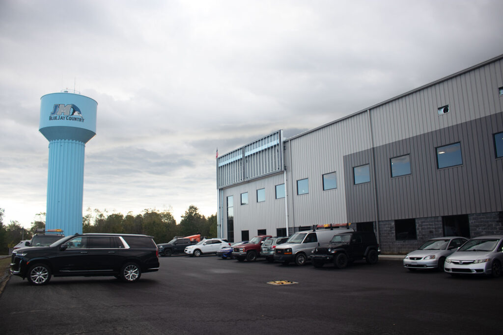 North Jackson warehouse outside, parking lot with cars, windows